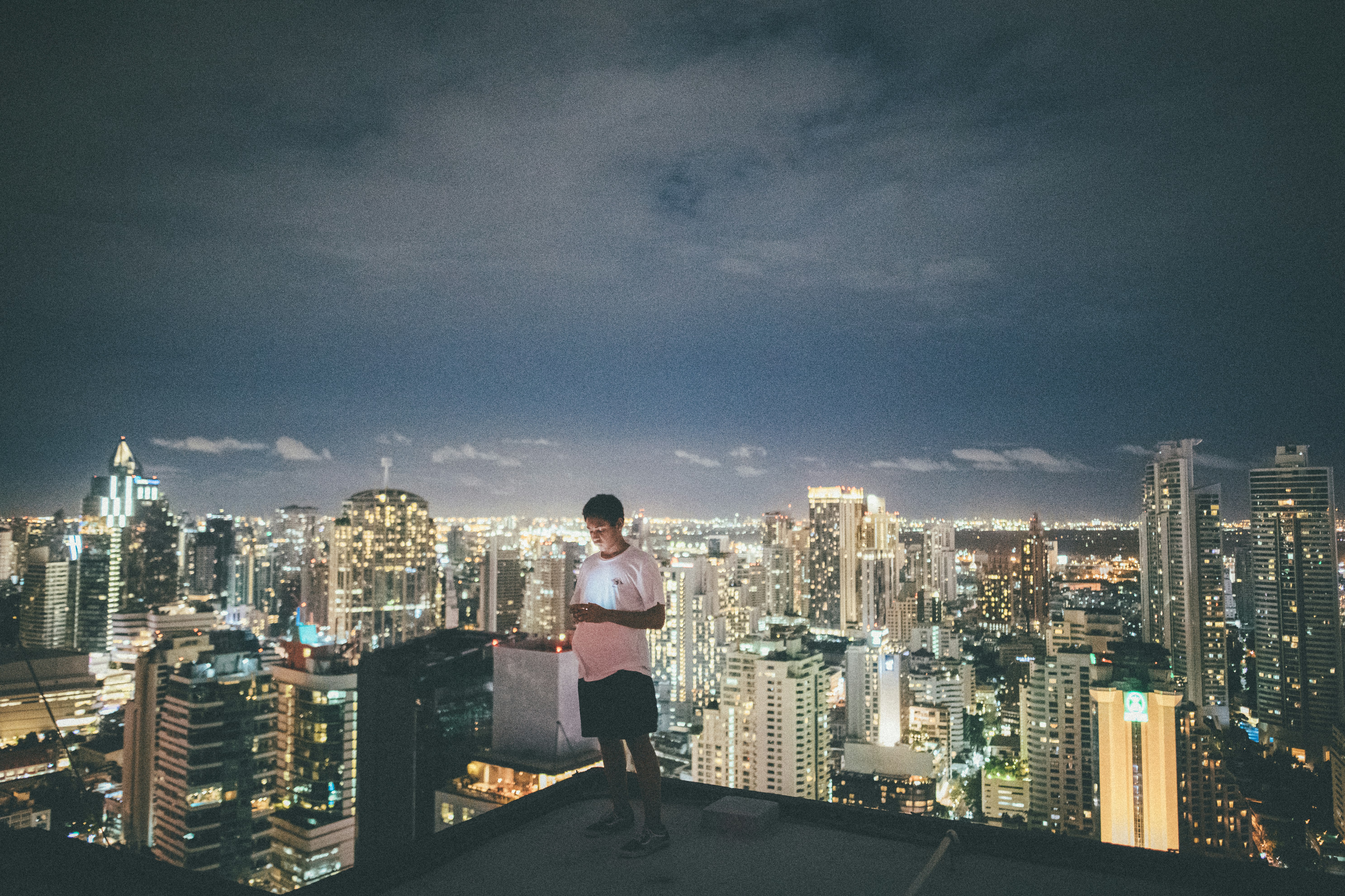 man standing on top of buidling